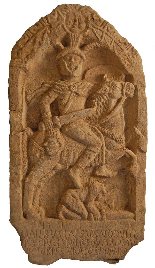 Photo of the Roman 'Insus Tombstone' at the City Museum. The carving depicts a Roman soldier mounted on a rearing horse. He holds a sword in one hand and a severed head in the other.